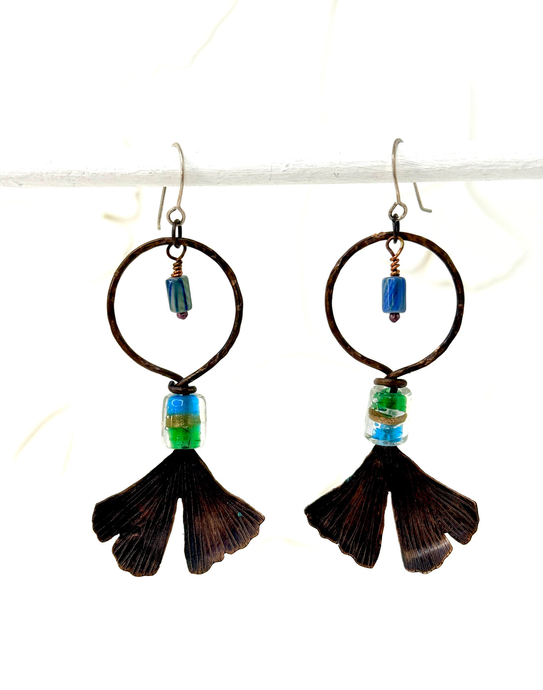 Resilience of the Ginkgo Hand Engraved Copper & Blue Green/Gold Glass Bead Earrings.