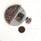 Tribute to Women of Craft Rhodonite, Steel, & Handwoven Fabric Brooch